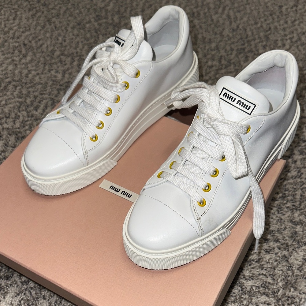 Miu Miu White Sneakers with Gold Eyelets